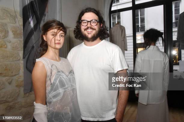 Designer Chase Shuman poses with his models during the Alexis Mabille’s creation Womenswear Spring/Summer 2024 presentation as part of Paris Fashion...