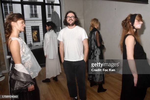 Designer Chase Shuman poses with his models during the Alexis Mabille’s creation Womenswear Spring/Summer 2024 presentation as part of Paris Fashion...