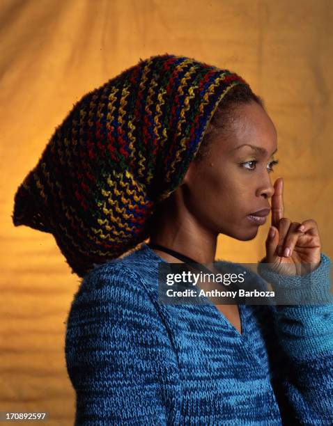 Profile portrait of American R&B, jazz, and pop singer Erykah Badu , New York, 2000.