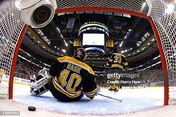 Tuukka Rask of the Boston Bruins fails to save the game winning goal by Brent Seabrook of the Chicago Blackhawks in overtime in Game Four of the 2013...