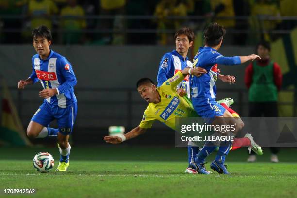 Takayuki Morimoto of JEF United Chiba is challenged by Montedio Yamagata defense during the J.League J1 Promotion Playoff final between JEF United...