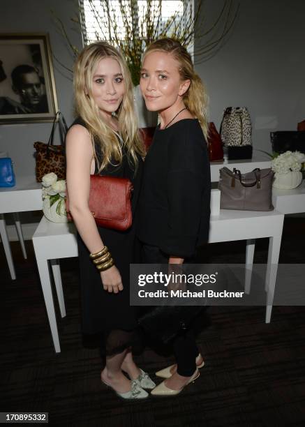 Ashley Olsen and Mary-Kate Olsen attend Mary-Kate Olsen, Ashley Olsen, and InStyle Editor Ariel Foxman celebrate the launch of the Elizabeth and...