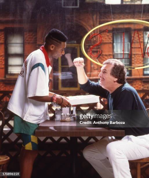 Portrait of American film director and actor Spike Lee and actor Danny Aiello on the set of their film 'Do the Right Thing' , New York, 1989.