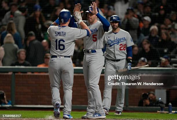 Will Smith of the Los Angeles Dodgers is congratulated by Freddie Freeman after Smith hit a two-run home run against the San Francisco Giants in the...