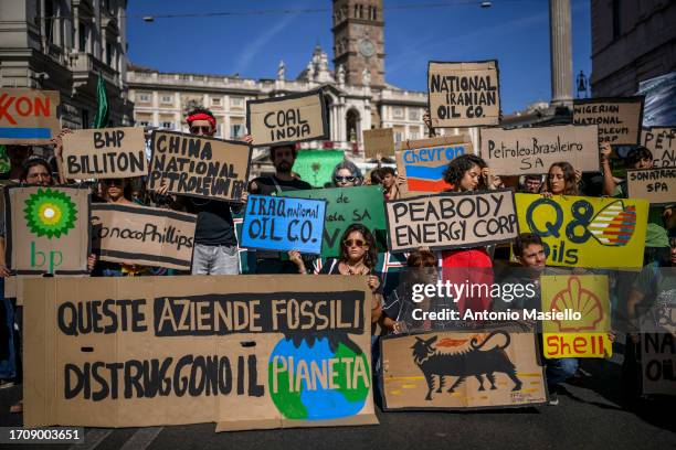 Climate activists and school students shout slogans and hold signs during a demonstration organized by Fridays For Future movement, on October 06,...