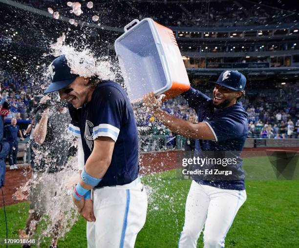 Bobby Witt Jr. #7 of the Kansas City Royals is doused with water by MJ Melendez as they celebrate a 12-5 win over the New York Yankees at Kauffman...