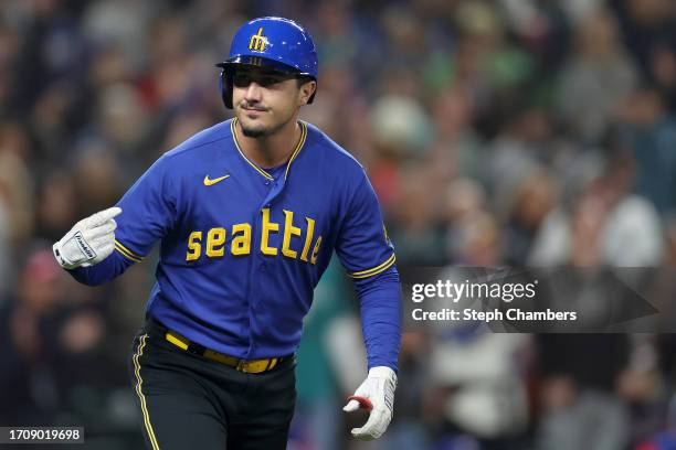 Josh Rojas of the Seattle Mariners celebrates his solo home run during the third inning against the Texas Rangers at T-Mobile Park on September 29,...