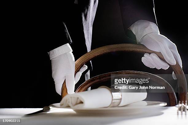 maitre d' preparing dining table - waiter stock pictures, royalty-free photos & images