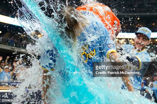 Caleb Boushley of the Milwaukee Brewers is dunked with Gatorade after the Brewers defeated the Chicago Cubs 4-3 at American Family Field on September...