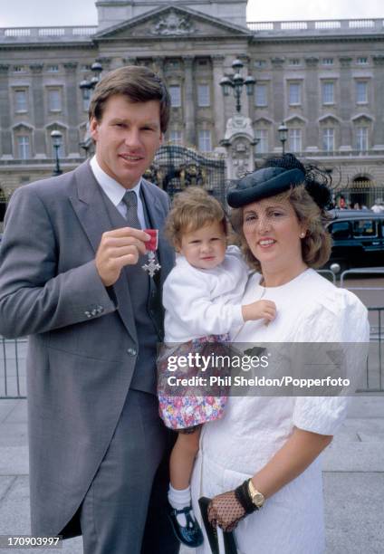 Nick Faldo of Great Britain poses with his wife Gill and daughter Natalie outside Buckingham Palace, after receiving his MBE, circa August 1988.