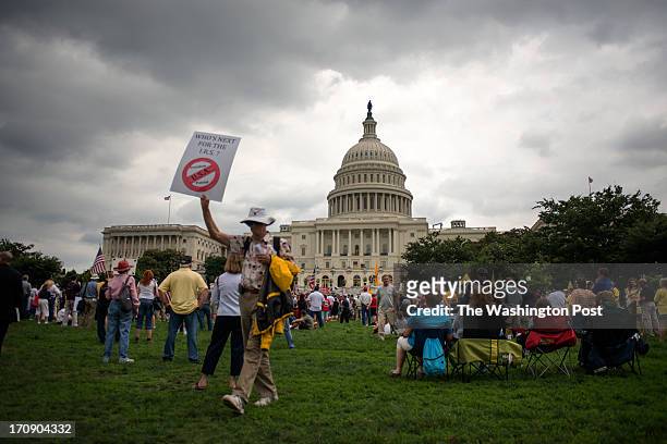 Hundreds of members of the Tea Party rally against President Obama's policies, the Internal Revenue Service and the Affordable Care Act on the West...
