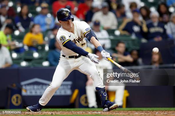 Mark Canha of the Milwaukee Brewers singles against the St. Louis Cardinals at American Family Field on September 28, 2023 in Milwaukee, Wisconsin.