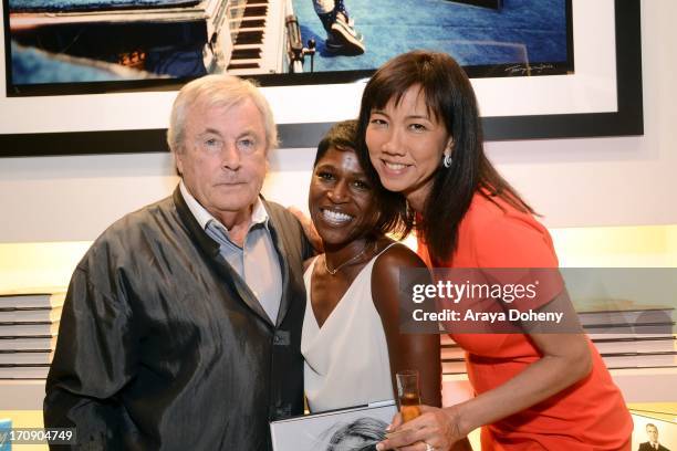 Terry O'Neill, Cheryl Fox and Keiko Noah attend a gallery exhibit of Terry O'Neill Presents The Opus: A 50 Year Retrospective at Mouche Gallery on...