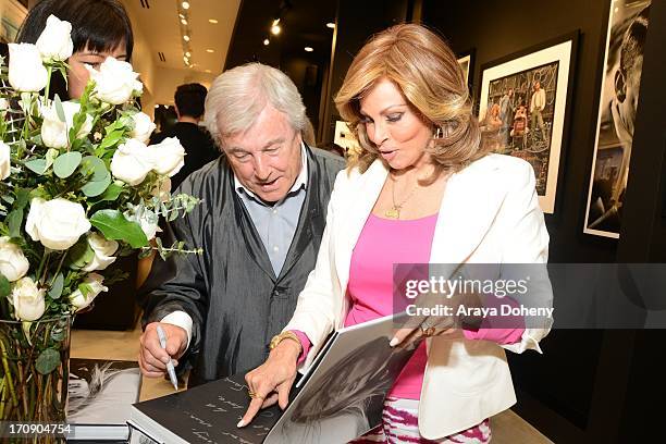 Terry O'Neill and Raquel Welch attend a gallery exhibit of Terry O'Neill Presents The Opus: A 50 Year Retrospective at Mouche Gallery on June 19,...