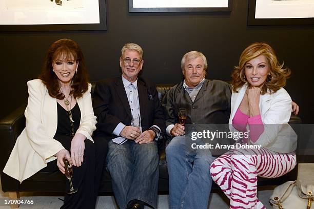 Jackie Collins, Barry Krost, Terry O'Neill and Raquel Welch attend a gallery exhibit of Terry O'Neill Presents The Opus: A 50 Year Retrospective at...