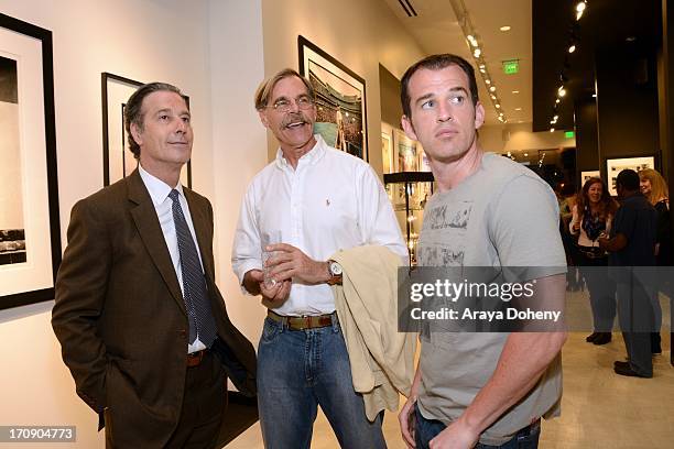 Robin Morgan, Jeffrey Glover and Liam Dunaway O'Neill attend a gallery exhibit of Terry O'Neill Presents The Opus: A 50 Year Retrospective at Mouche...