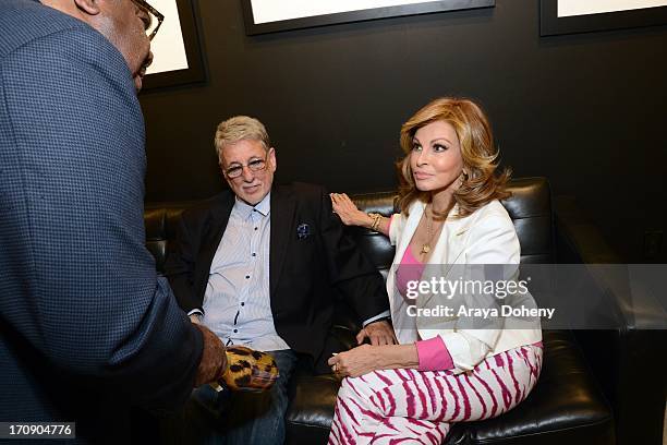 Barry Krost and Raquel Welch attend a gallery exhibit of Terry O'Neill Presents The Opus: A 50 Year Retrospective at Mouche Gallery on June 19, 2013...