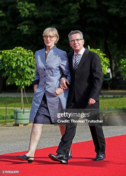 German Defence Minister Thomas de Maiziere and his wife Martina attend the dinner given in honour of U.S. President Barack Obama at the Orangerie of...