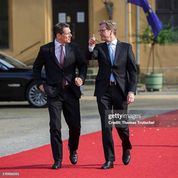 German Foreign Minister Guido Westerwelle and Michael Mronz, attend the dinner given in honour of U.S. President Barack Obama at the Orangerie of...