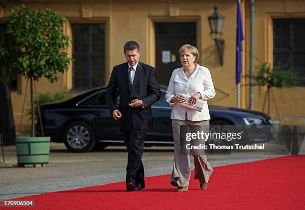 German Chancellor Angela Merkel and her husband Joachim Sauer attend the dinner given in honour of U.S. President Barack Obama at the Orangerie of...