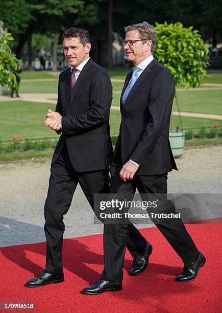 German Foreign Minister Guido Westerwelle and Michael Mronz, attend the dinner given in honour of U.S. President Barack Obama at the Orangerie of...