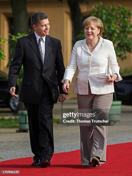 German Chancellor Angela Merkel and her husband Joachim Sauer attend the dinner given in honour of U.S. President Barack Obama at the Orangerie of...