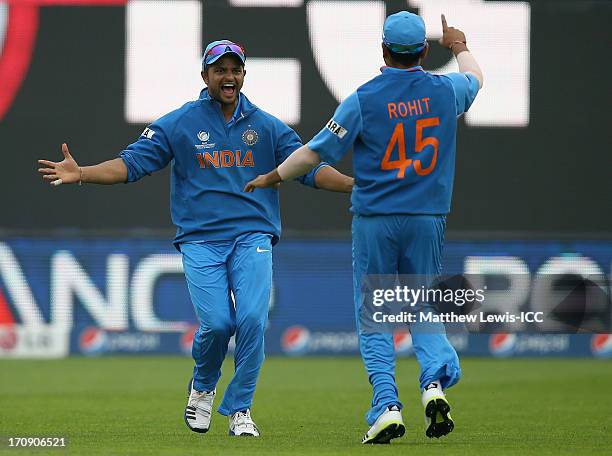 Suresh Raina of India celebrates catching Kusal Perera of Sri Lanka with Rohit Sharma during the ICC Champions Trophy Semi Final match between India...