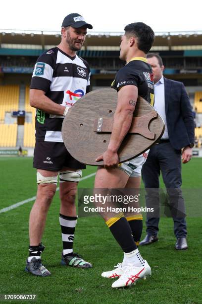 Du’Plessis Kirifi of Wellington hands the Ranfurly Shield to Tom Parsons of Hawkes Bay during the round nine Bunnings Warehouse NPC match between...