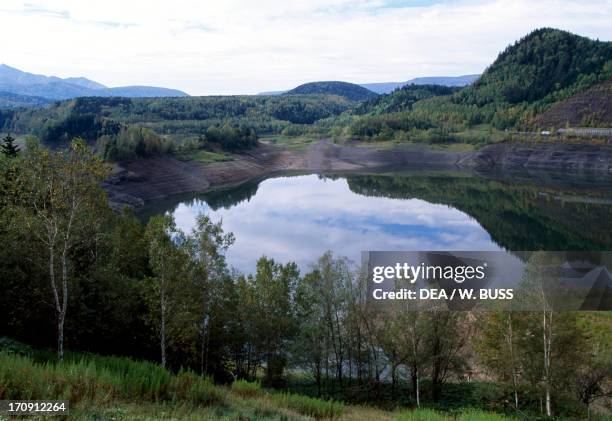 Lake between the woods, Daisetsuzan National Park between Sounkyo Onsen and Motoyama, Hokkaido, Japan.