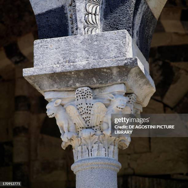 Capital decorated with monstrous figures, portico of the Basilica of the Holy Trinity of Saccargia , Codrongianos, Sardinia, Italy.