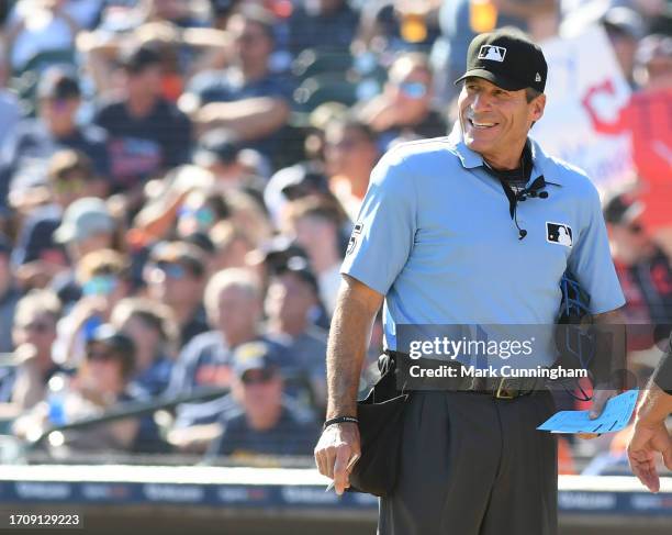 Major League umpire Angel Hernandez looks on and smiles during the game between the Cleveland Guardians and the Detroit Tigers at Comerica Park on...