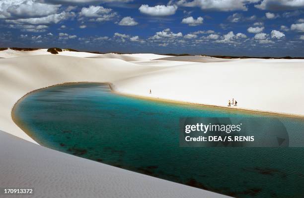 The sand dunes known as white sheets and freshwater lakes of changing colours, formed by precipitation, Lencois Maranhenses National Park, State of...
