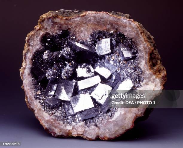Galena pasted into Quartz geode, fake minerals, from Morocco.