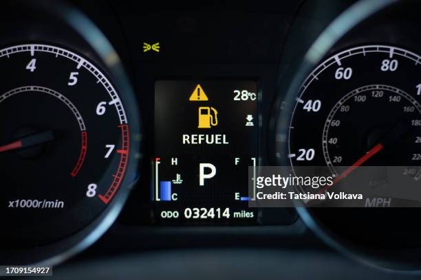 refuel nedded, car dashboard with an icon indicating that the car needs to be refueled - auto cockpit stock pictures, royalty-free photos & images