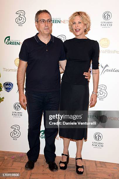 Meg Ryan and Mario Sesti attend a photocall as part of Taormina Filmfest 2013 on June 20, 2013 in Taormina, Italy.