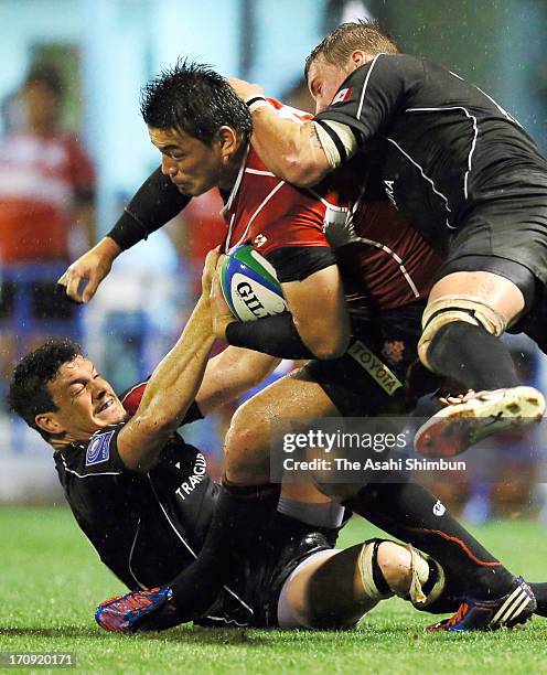 Ayumu Goromaru of Japan runs with the ball during the IRB Pacific Nations Cup match between Japan and Canada at Mizuho Stadium on June 19, 2013 in...