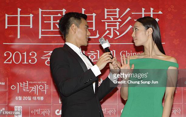 Actor Eddie Peng and actress Bai Baihe attend the closing film 'A Wedding Invitation' press conference during the 2013 Chinese Film Festival at...