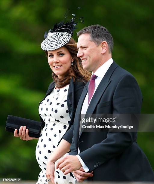 Catherine, Duchess of Cambridge, accompanied by her police protection officer, attends the wedding of William van Cutsem and Rosie Ruck Keene at the...