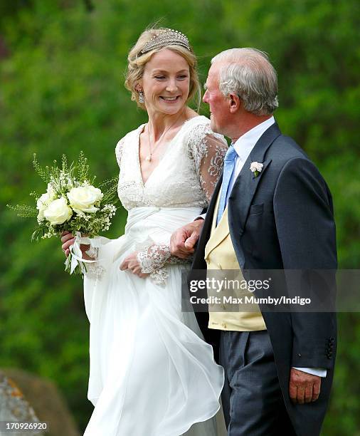 Rosie Ruck Keene arrives at the church of St Mary the Virgin in Ewelme for her wedding on May 11, 2013 near Oxford, England.