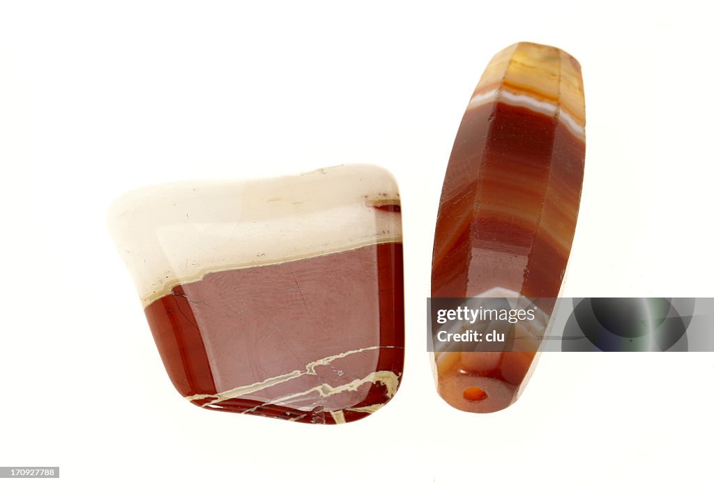 Two red stones on white