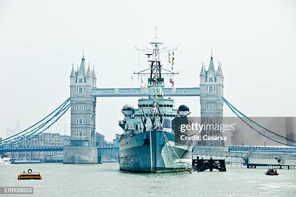 hms belfast battle ship on thames river - warship stock pictures, royalty-free photos & images