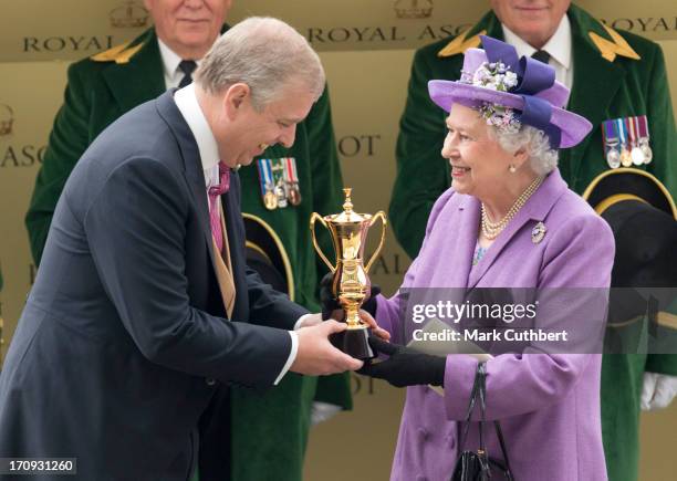 Queen Elizabeth II is presented The Gold Cup by Prince Andrew, Duke of York after her horse "Estimate" won during Ladies Day on Day 3 of Royal Ascot...