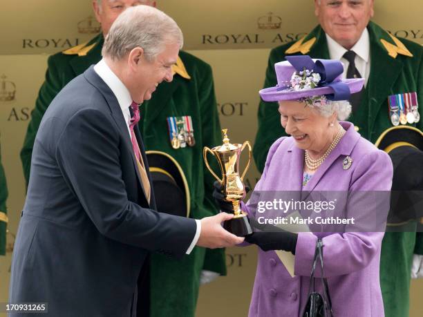 Queen Elizabeth II is presented The Gold Cup by Prince Andrew, Duke of York after her horse "Estimate" won during Ladies Day on Day 3 of Royal Ascot...