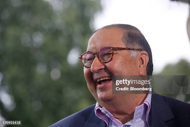 Alisher Usmanov, Russian billionaire owner of USM Holdings Ltd., reacts during a Bloomberg Television interview on the opening day of the St....