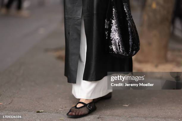 Daniela Lipps is seen outside Gauchere show wearing black net Alaia ballet flats during the Womenswear Spring/Summer 2024 as part of Paris Fashion...