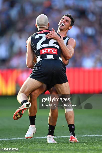 Steele Sidebottom of the Magpies and Scott Pendlebury of the Magpies celebrate during the 2023 AFL Grand Final match between Collingwood Magpies and...