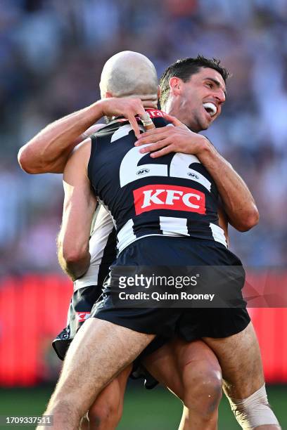 Steele Sidebottom of the Magpies and Scott Pendlebury of the Magpies celebrate during the 2023 AFL Grand Final match between Collingwood Magpies and...