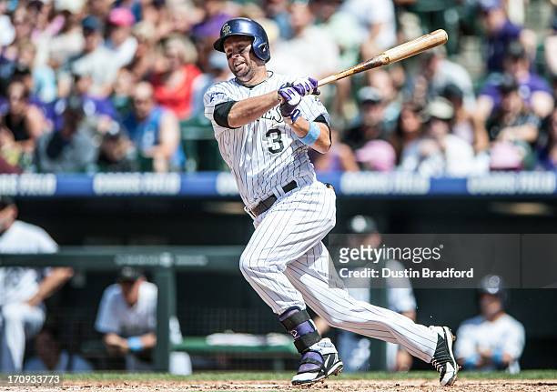 Michael Cuddyer of the Colorado Rockies puts a ball in play against the Philadelphia Phillies during a game at Coors Field on June 16, 2013 in...