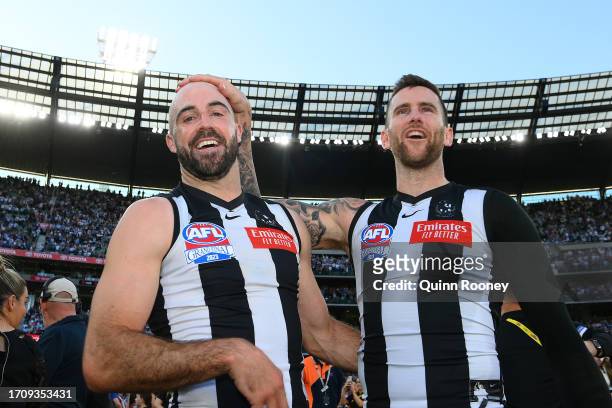 Steele Sidebottom of the Magpies and Jeremy Howe of the Magpies celebrate winning the premiership during the 2023 AFL Grand Final match between...