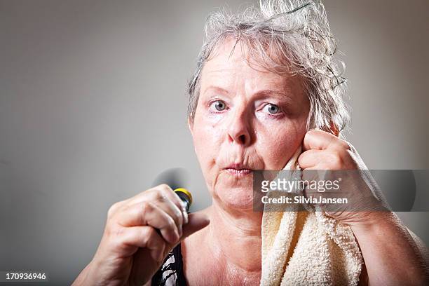 mature woman having hot flash - hot flash stock pictures, royalty-free photos & images